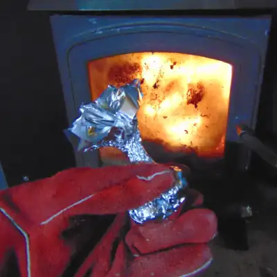 Placing sweet chestnuts on log burner